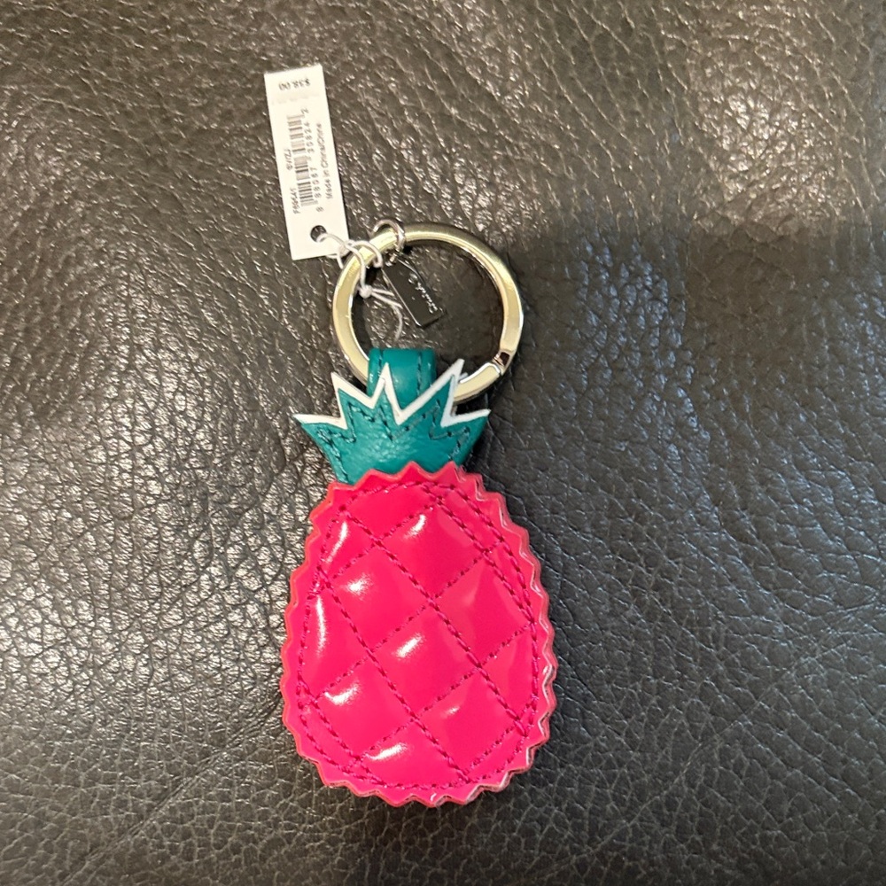 Coach dark pink pineapple key chain